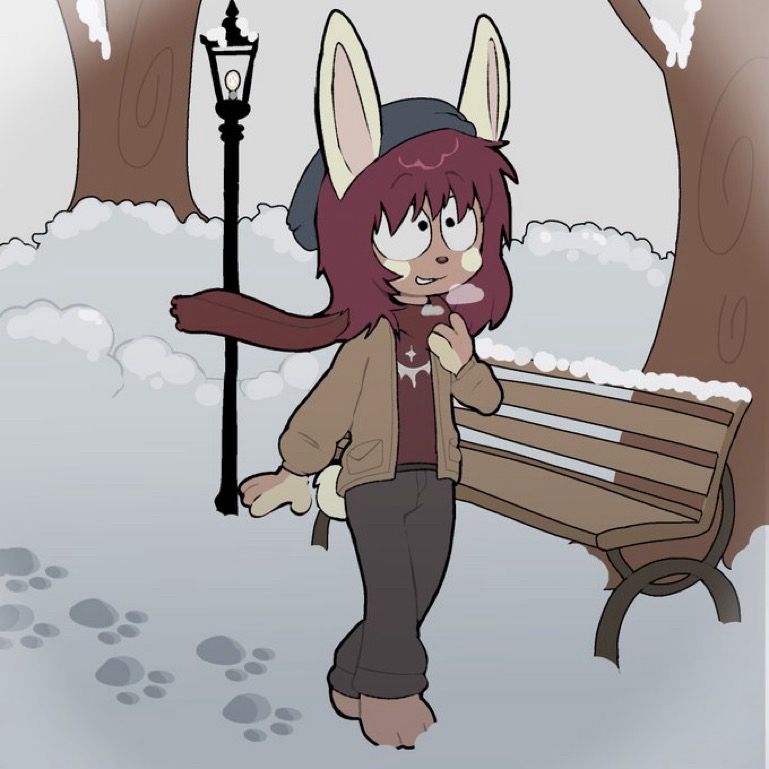 Kanin walking through a winter park, scarf blowing behind him. He looks up at the overcast sky with a small smile on his face. 