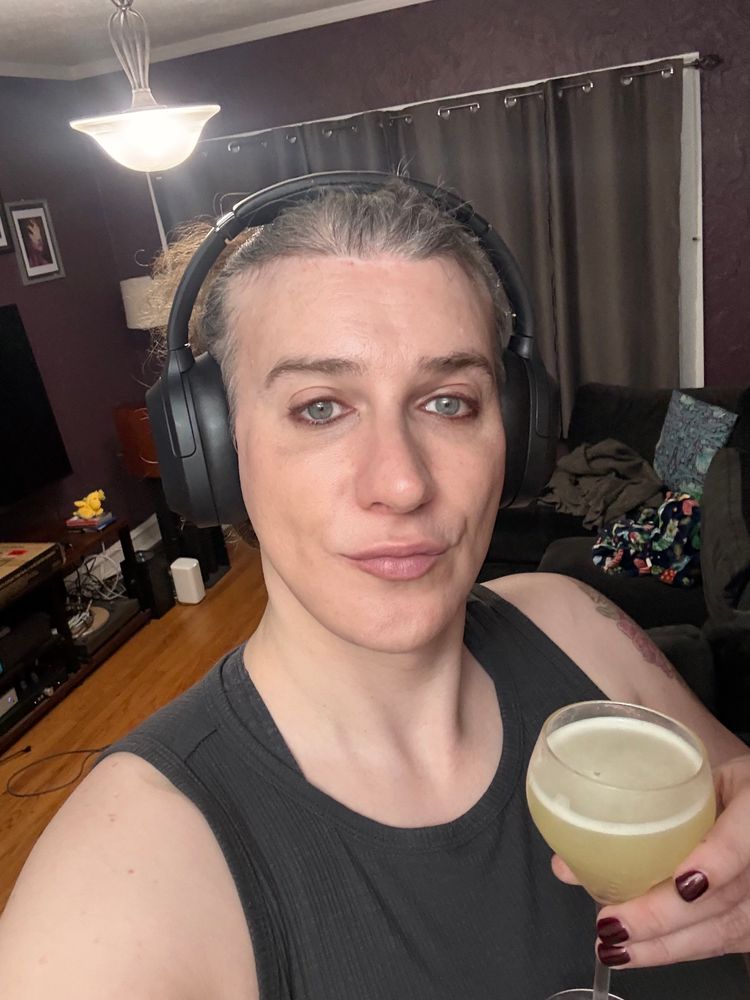 The Maggie holding a yuzu sour looking burnt out