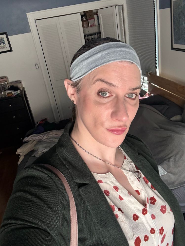 A maggie up close wearing too much makeup