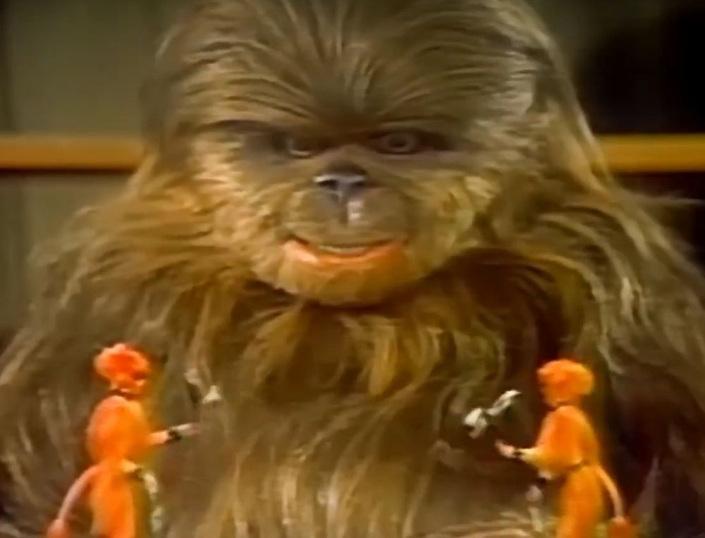 From the Star Wars Holiday Special, Lumpy staring in wonder at two juggling aliens