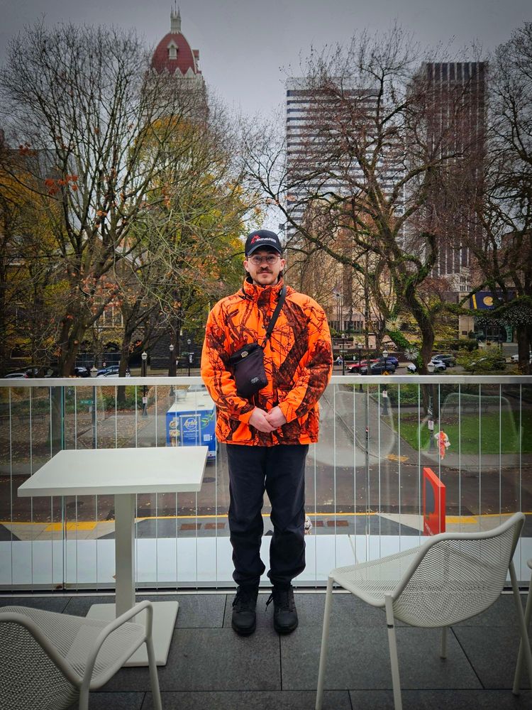 A picture of me with downtown Portland in the background 