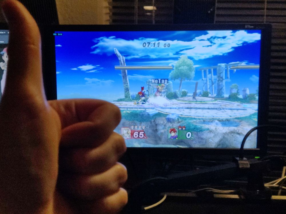 Project m on my PC screen with a thumbs up 