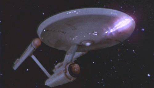 The USS Enterprise firing photon torpedoes