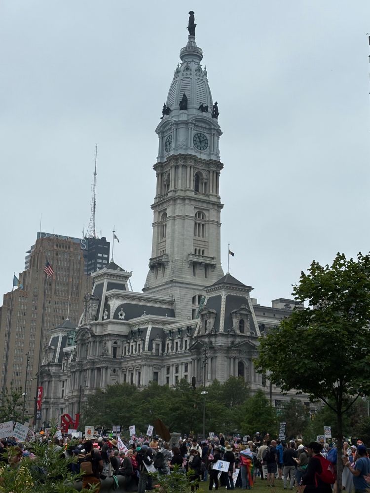 Photo of protest at LOVE Park in Philadelphia with City Hall in background. 