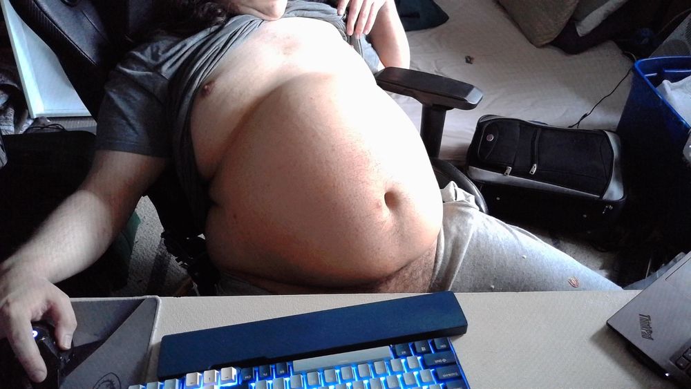 Sitting back in my chair with my HUGELY INFLATED belly out, controlling the webcam with my mouse