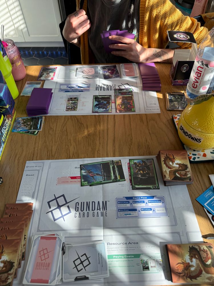 Ify and Em playing Gundam TCG