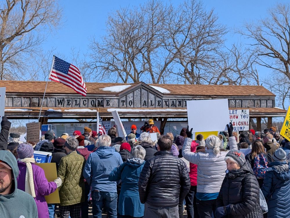 Listening to speakers in the park before our March