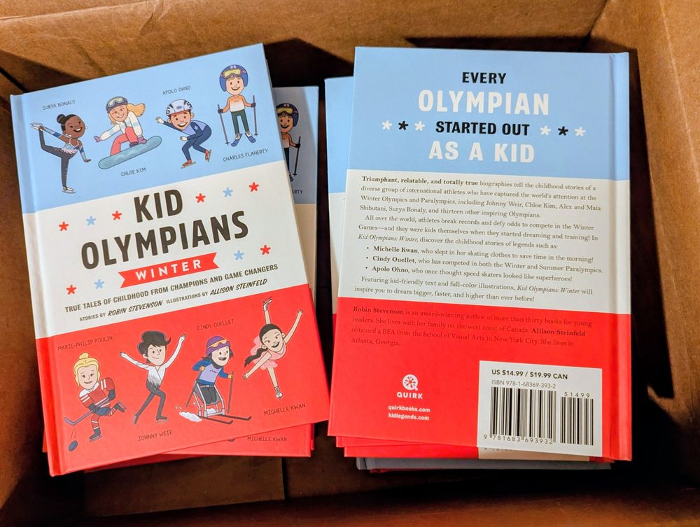 A box containing copies of the book KID OLYMPIANS: WINTER.