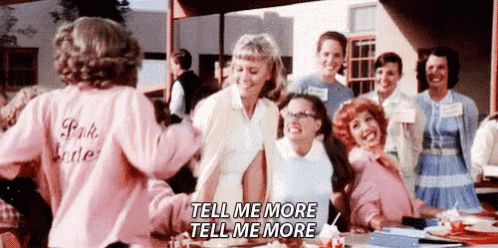 Pink ladies begging Sandy, from Gease, to give them more details about this man. 