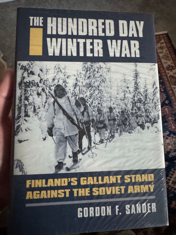 “THE HUNDRED DAY WINTER WAR, Finland’s Gallant Stand against the Soviet Army” by Gordon F Sandor 
The image on the book shows Finnish Soldiers on skis 🎿 going through the forest