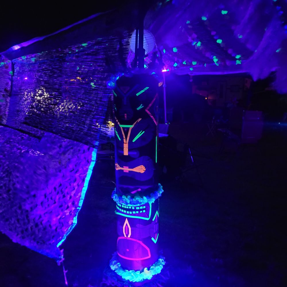 Our dining tent at the Winnipeg Folkfest campground. Blacklight tiki theme