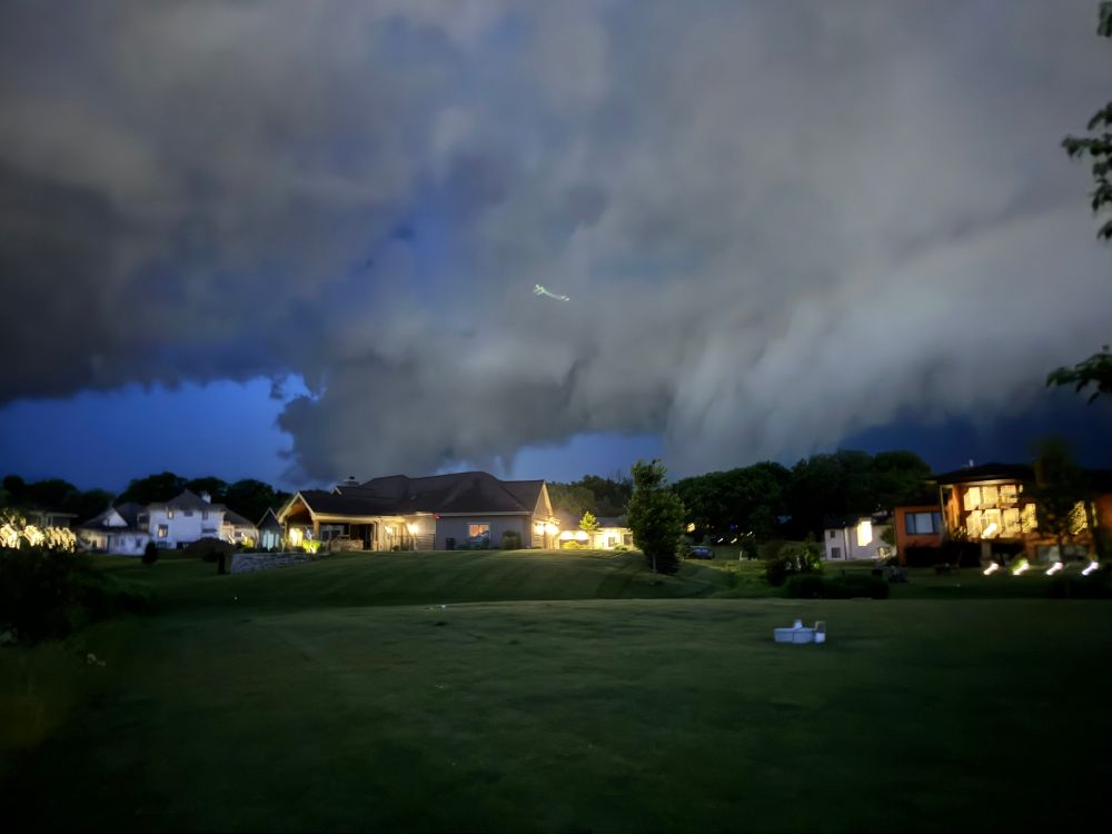 Storm clouds with ragged front edge. 