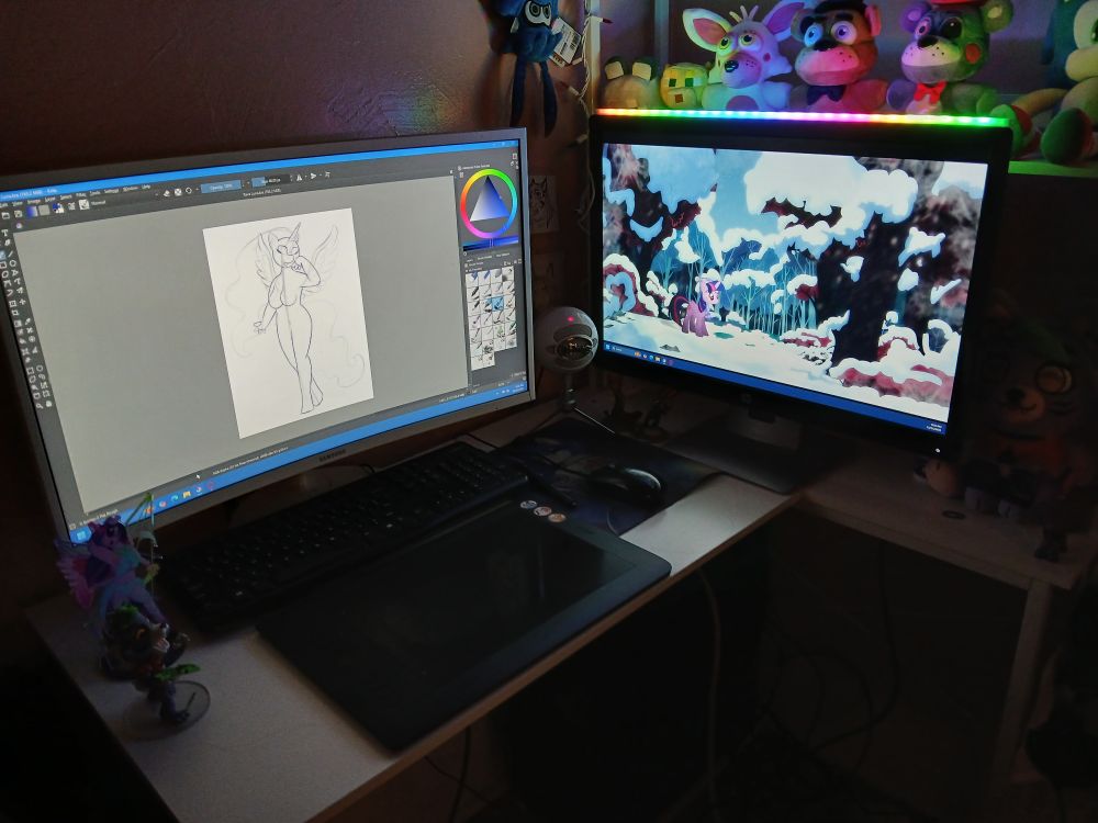 A photo of my computer desktop, showing dual screen mode now operational.
