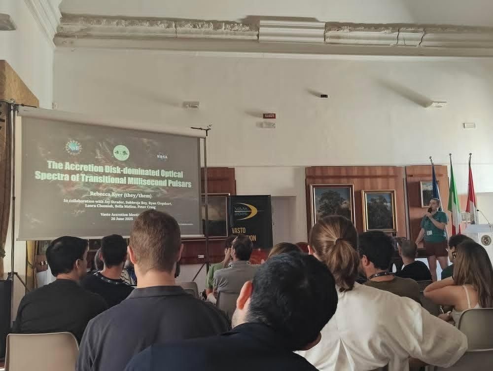 me and my title slide facing a seated audience