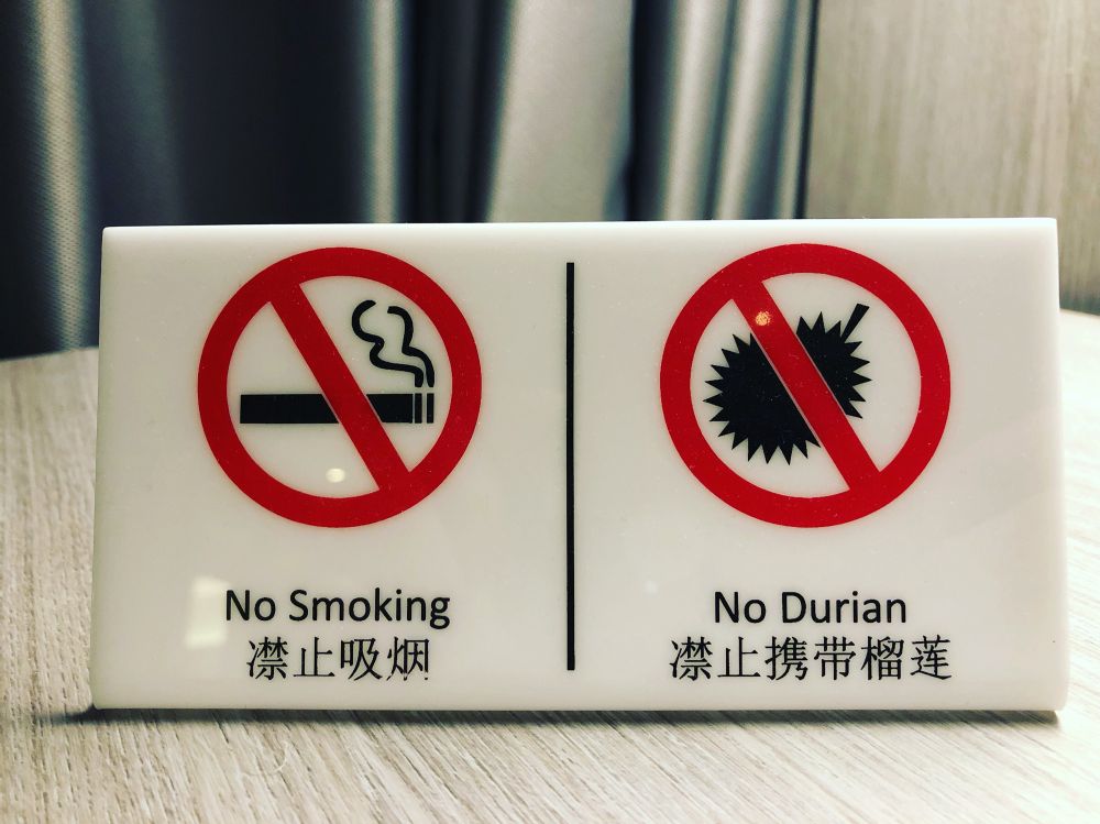 a “no smoking” and “no durian” sign