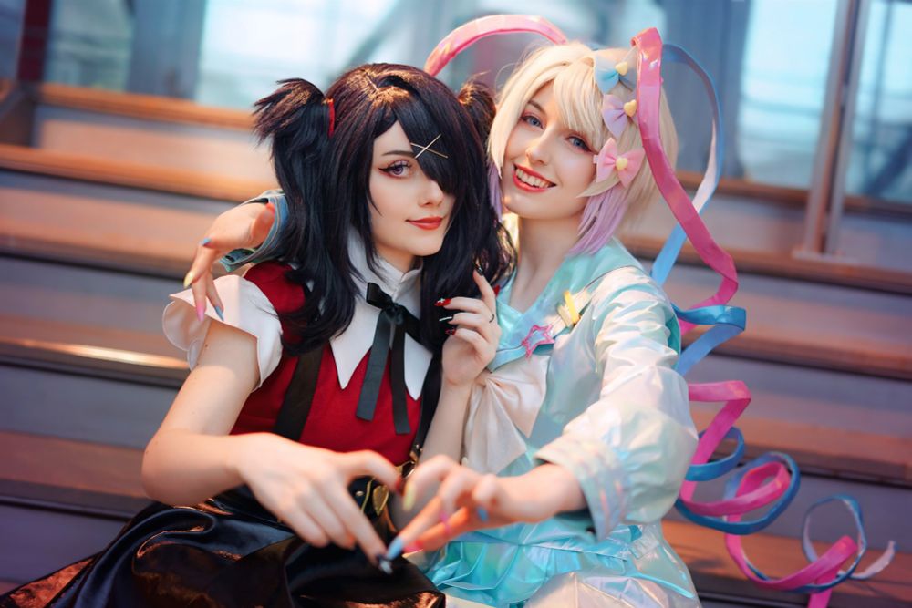 Two cosplayers of Ame-chan and KAngel are sitting on a staircase, smiling at the camera. They are forming a heart shape with their hands, and the background is softly blurred with natural light illuminating their faces.

tag ignore: ngo nso needy girl overdose streamer overload amechan cosplayer cosplaygirl cosplaygirl girl photo photography model cosplayphoto cosplayphotography cosplaymodel kofi ko-fi throne cute kawaii