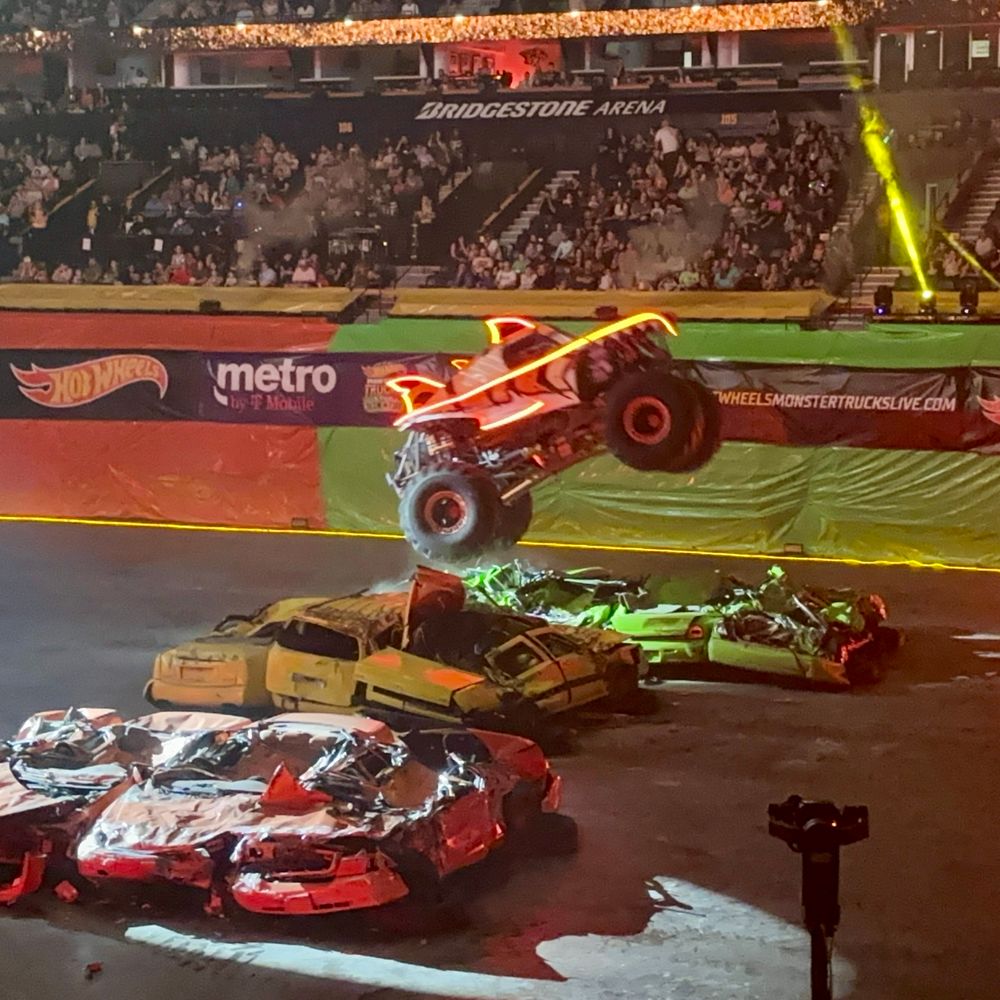 Monster truck jumping over cars. 