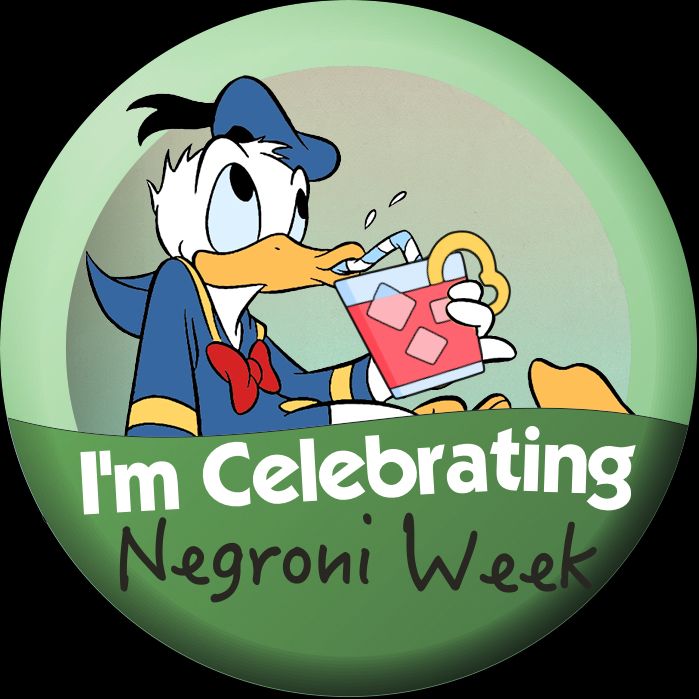 Disney World style "I'm Celebrating" pin for Negroni Week. Donald Duck is drinking a Negroni through a straw. 