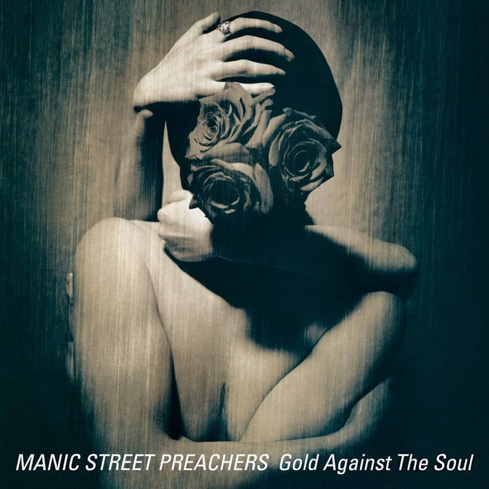 Album are for Manic Street Preachers: Gold Against the Soul. Roses covering a face. 