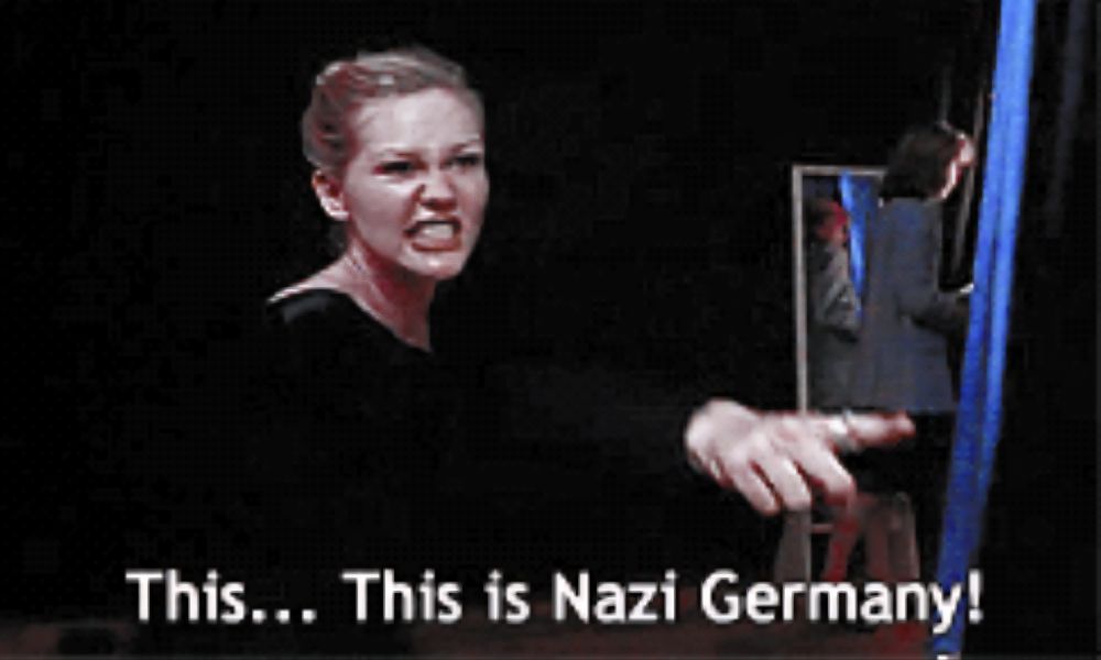 Kristen Dunst in Drop Dead Gorgeous on the side stage of a beauty pageant turning around and pointing while saying "This, this is Nazi Germany!" in a loud and emphatic whisper 