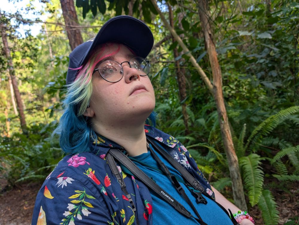 Dorian looking curiously up into the trees of the garden 