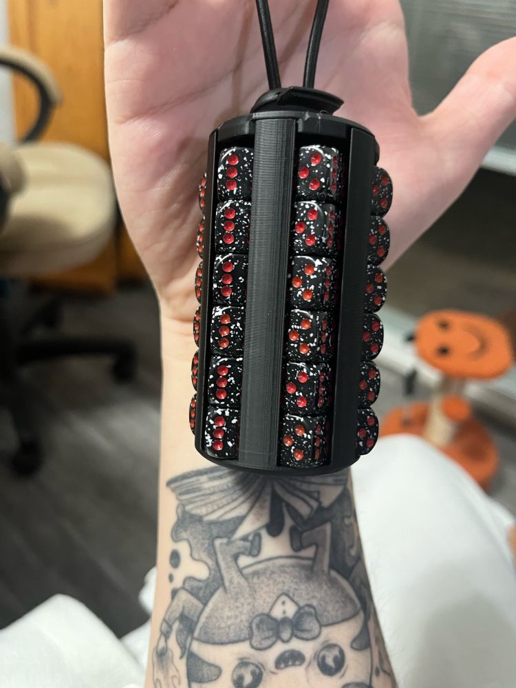 A magical dice holder by emmaskyeward. Holds 36 tiny dice used for card games