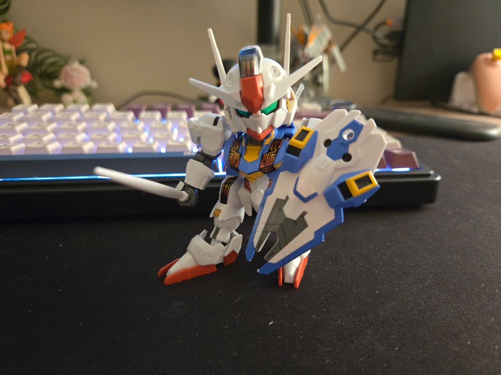 a miniature toy figurine of the XVX-016RN Aerial Rebuild from the show Mobile Suit Gundam: The Witch from Mercury