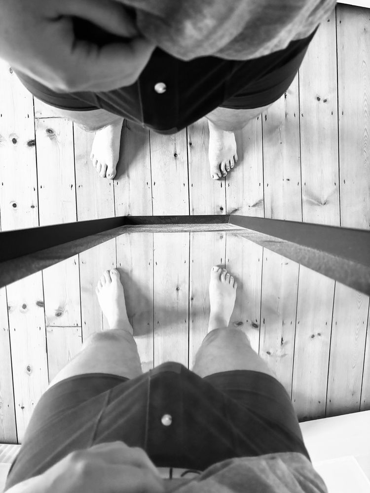 Man standing in his boxers in front of the mirror, his bulge is big and is reflected in the mirror