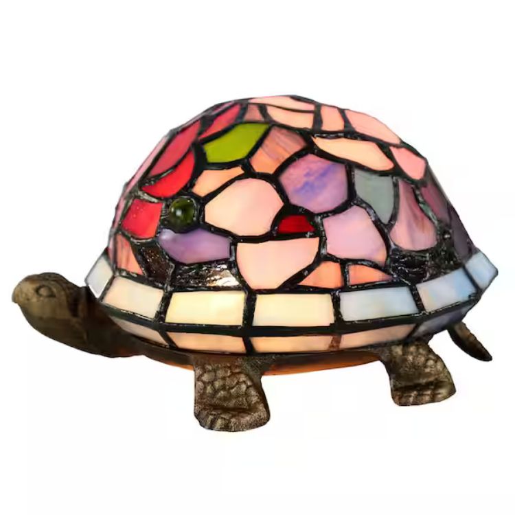 a lamp where it is a turtle with bronze head and feet and tail, and then the shell is stained glass 
