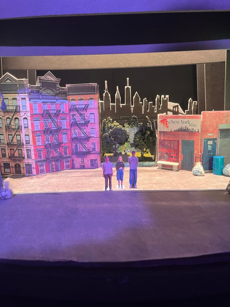 A diorama of a New York street scene