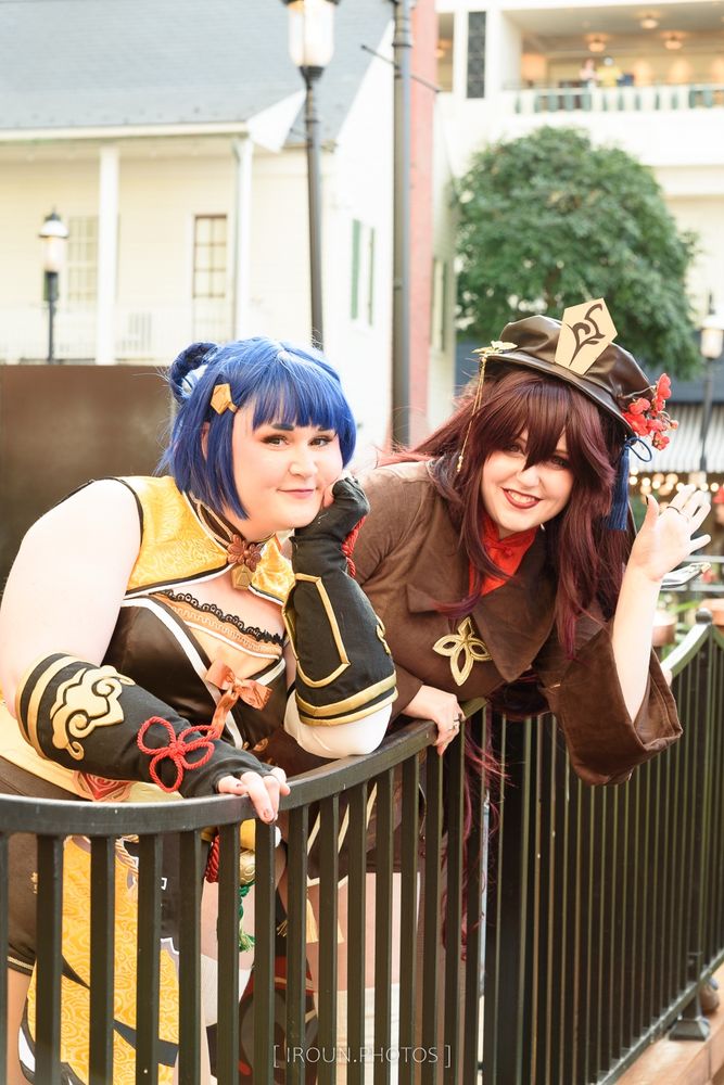 Arcadian Cosplay as Hu Tao from Genshin Impact and Owl Eerie Cosplay as Xiangling from Genshin Impact, photographed by Iroun Photos at Magfest 2024