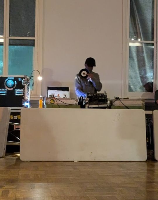 A man at some decks is holding a 45.