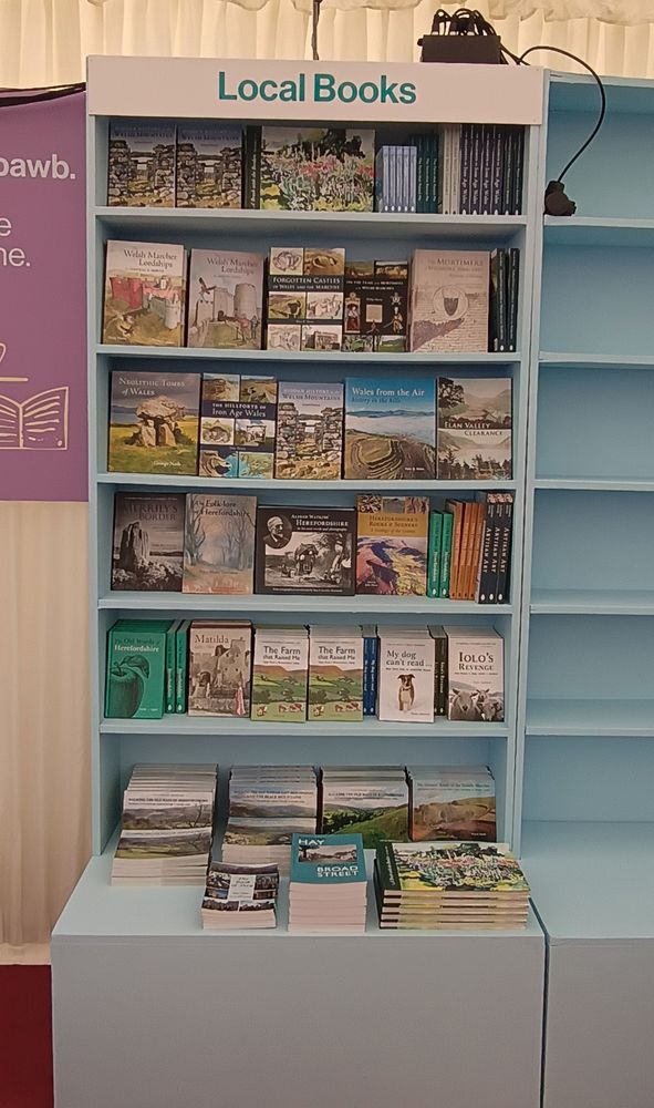 Photo of Local Books bookshelves in the Hay Festival bookshop, featuring Logaston Press books