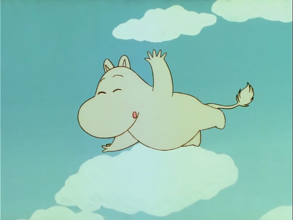 Moomin laughing while flying in the sky. The sky is blue with clouds.