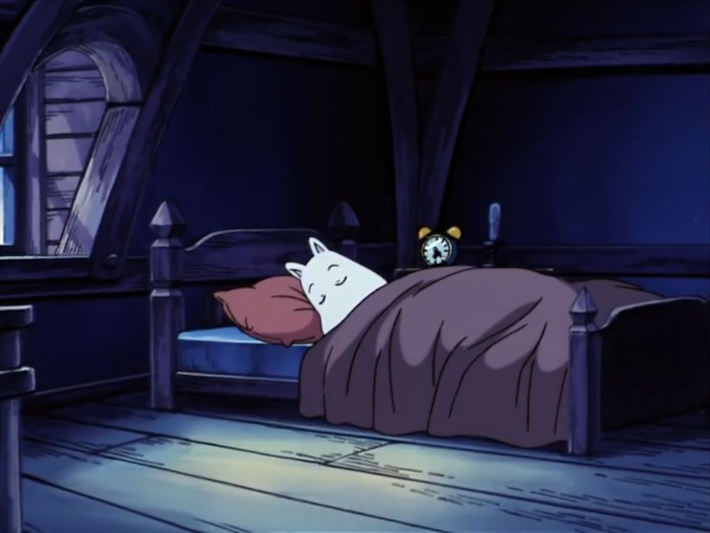 Moomin is asleep in his bed.