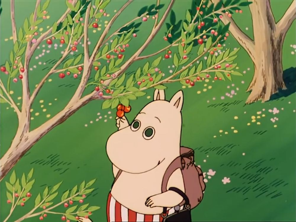 Moominmamma is picking up cherries from a three. 