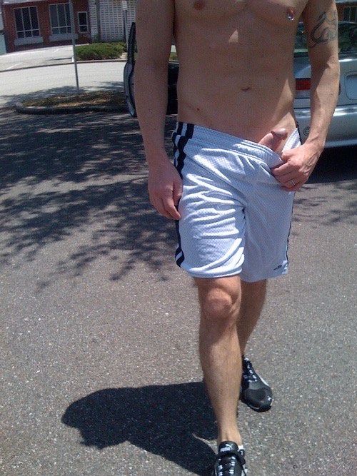 sunny day on the street and this dude pulls his erect dick out his bb shorts just enough to make us all horny