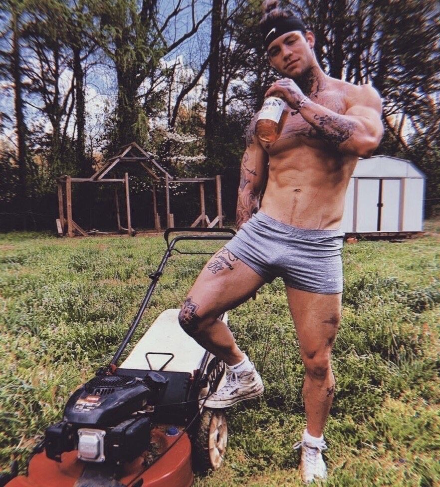 super hot cutie shirtless, taking a break from mowing ‘redneck style’  . . . while chugging liquor from the bottle