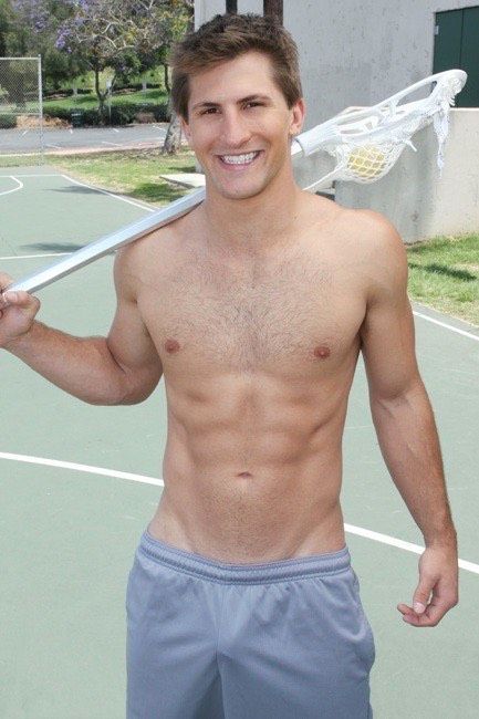 shirtless young dude with diagonal cut lines (cum gutters)pointing down to his dick bulge