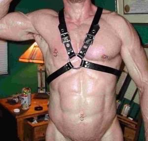 sweaty, harness-wearing, poz-looking dude with super defined cut lines (cum gutters) from his waist down to something we can not see