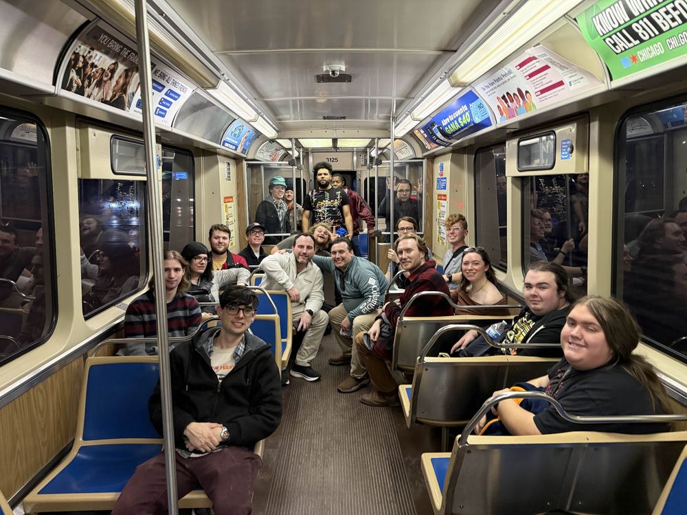 Many people looking at a camera inside a CTA 2600 series 