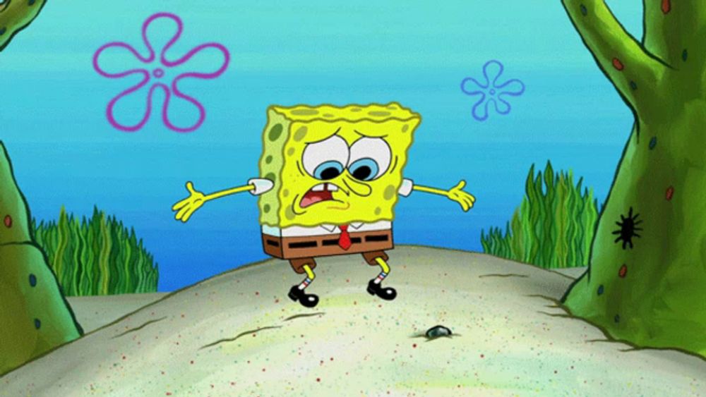 a cartoon of spongebob squarepants standing on the sand