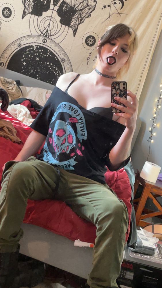 Zoey in her bedroom with slutty shoulders