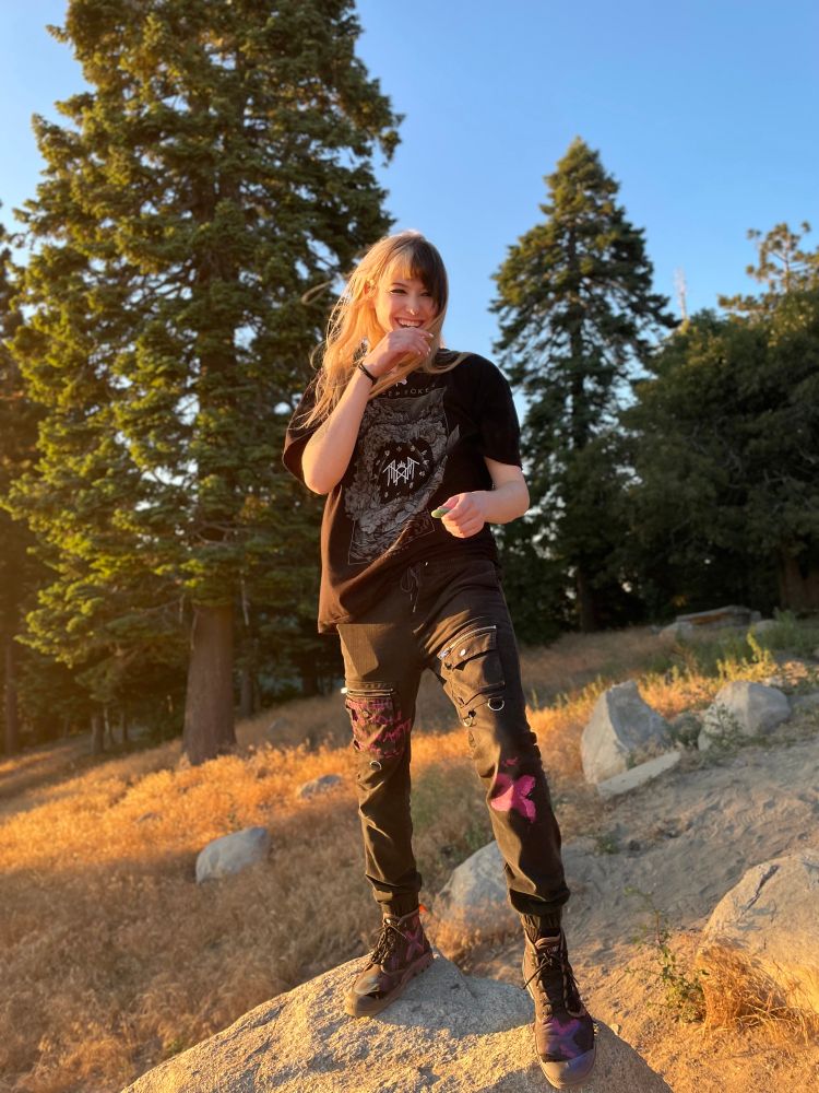 Zoey standing in the middle of the wilderness