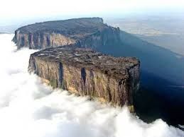 Tepui in Venezuela. Big flat mountain tops, reaching higher than the surrounding clouds.