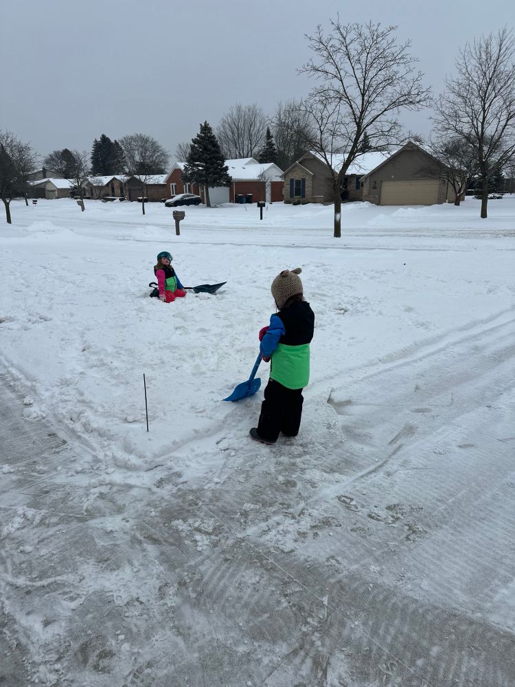 My daughters shoveling snow