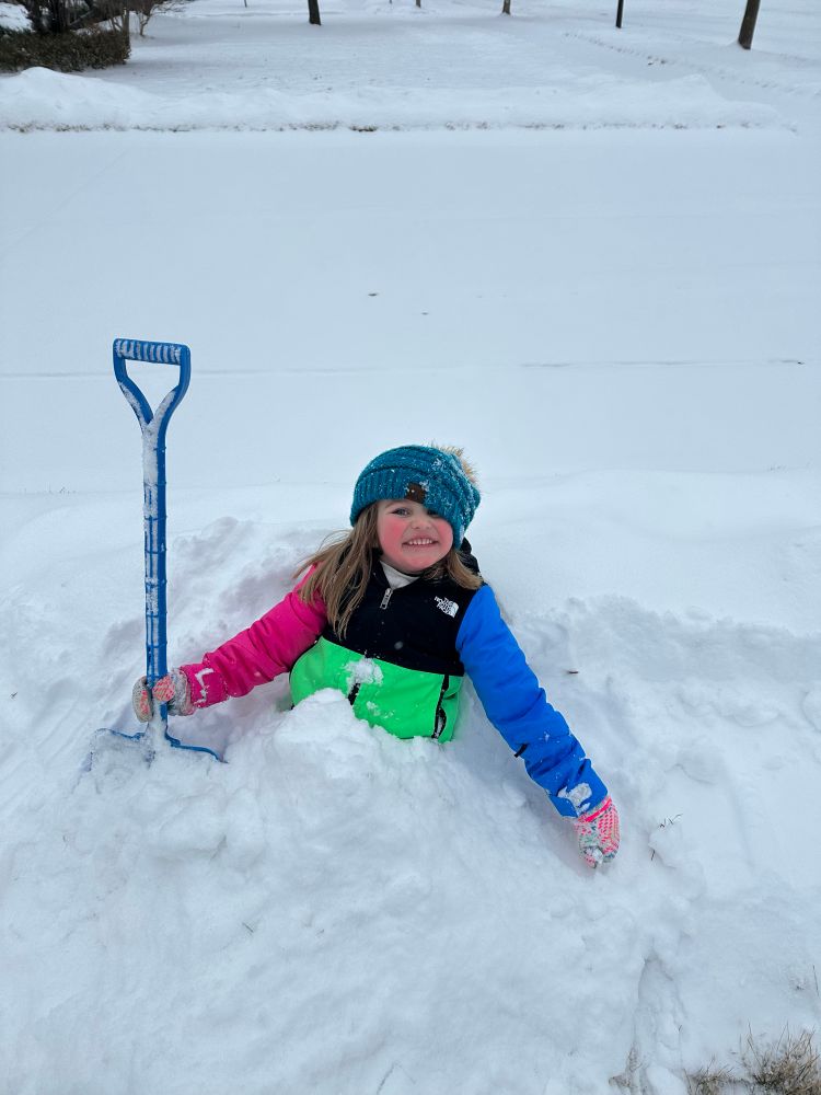 My daughter buried in snow