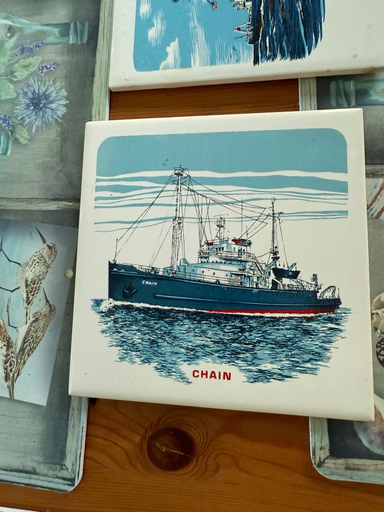 Ceramic tile with a picture of the R/V Chain