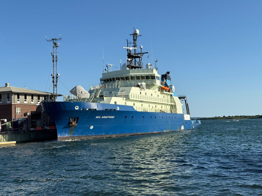 Big blue ship with white superstructure 