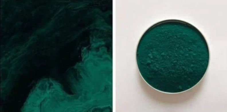 Colour swatch of paint in pthalo green, next to a tin of paint powder in the same colour
